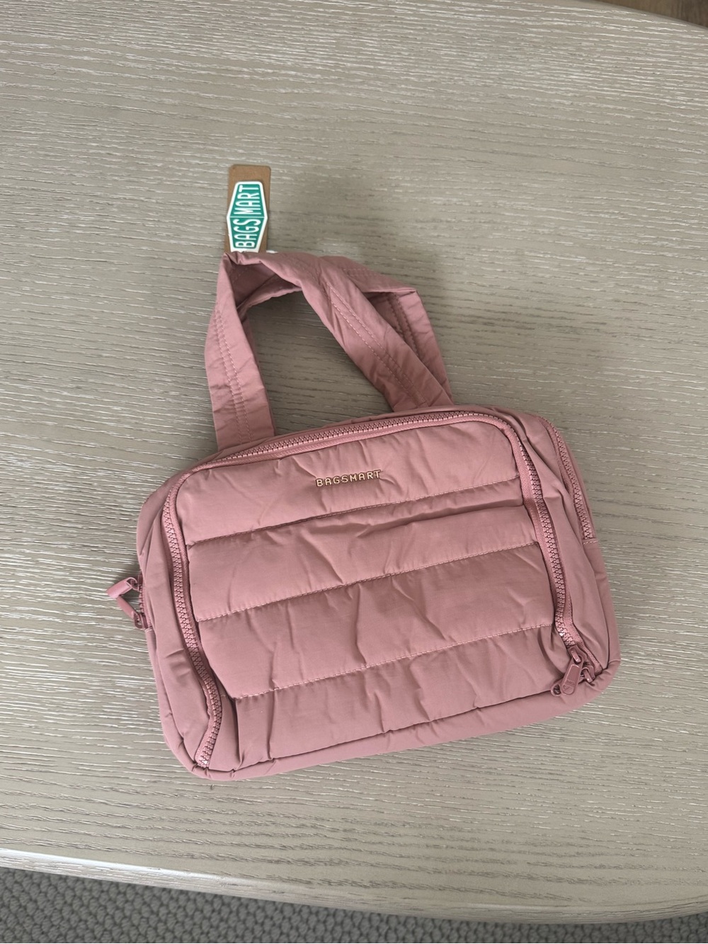 bagsmart mauve cosmetic bag with tags